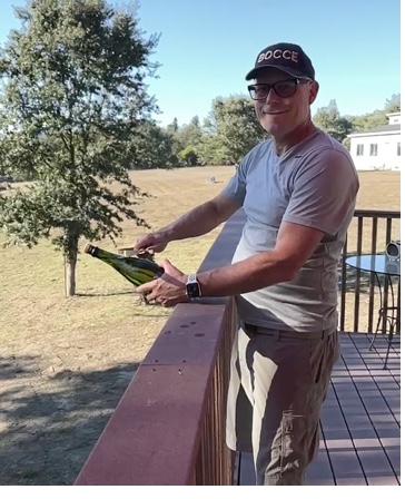 Disgorging a sparkling wine on the deck overlooking the property