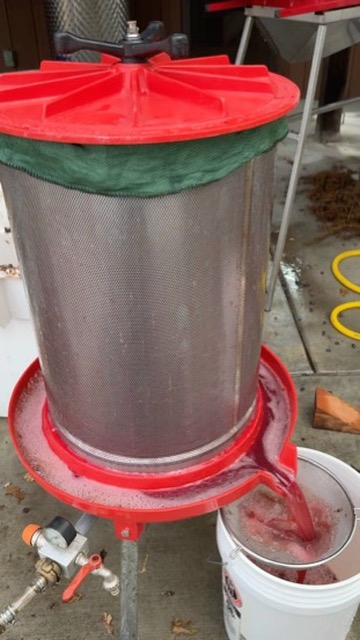 Red press running in the garage